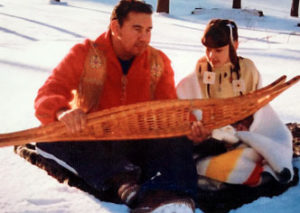 Dale and Mariah Cooper demonstrate snow-shoeing for the Ojibwa community