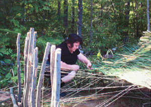 Nancy Penzkover loom-weaving reeds in Wisconsin