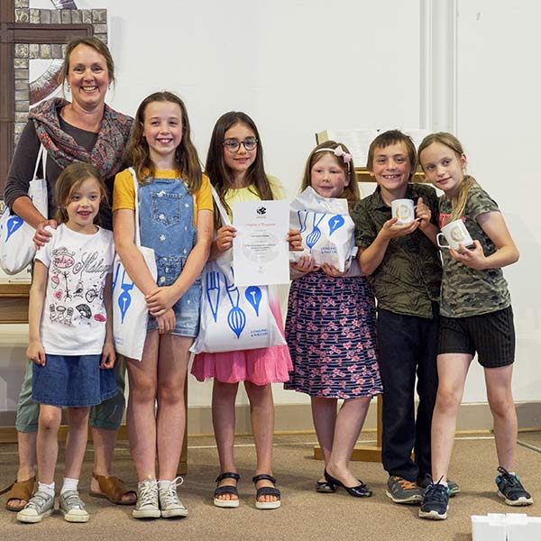 Teacher Lindsey Stephens and some of her students who won prizes in the art competition