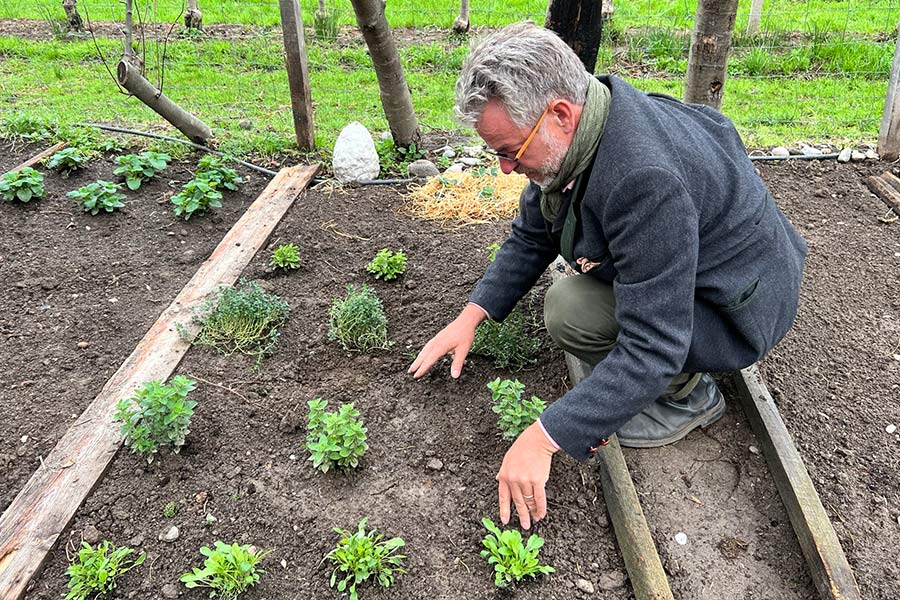 WOB Principal, Markus Feichter, shows how students learn to plant their own vegetables
