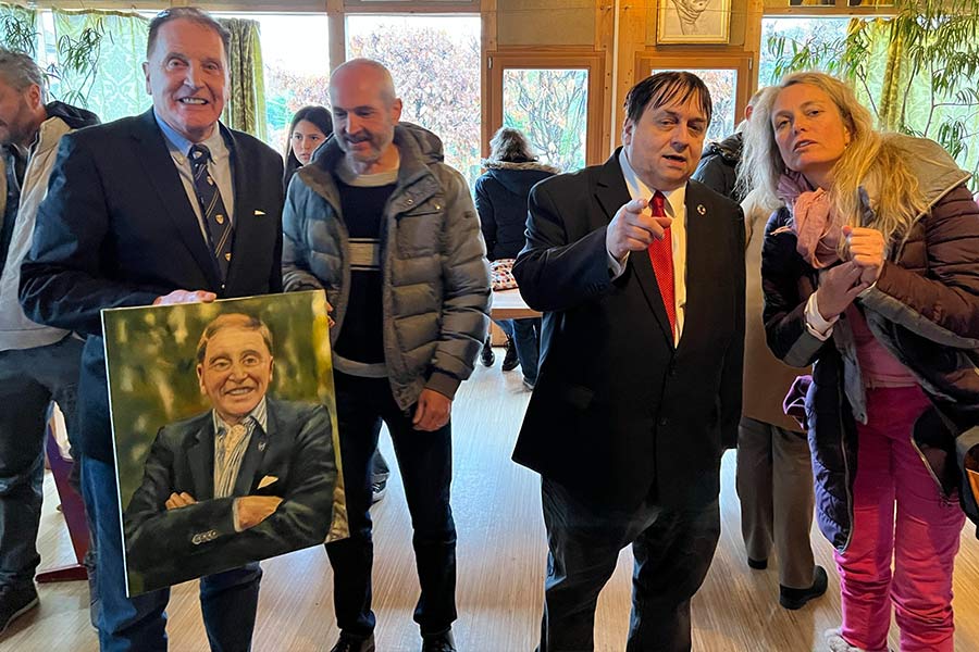 Dr Brenden Tempest-Mogg was presented with a portrait of himself at a gathering for parents.