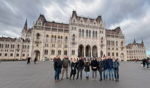 BuildingVids participants pose outside the impressive Hungarian Parliament